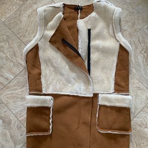 A faux suede and fur vest with zipper